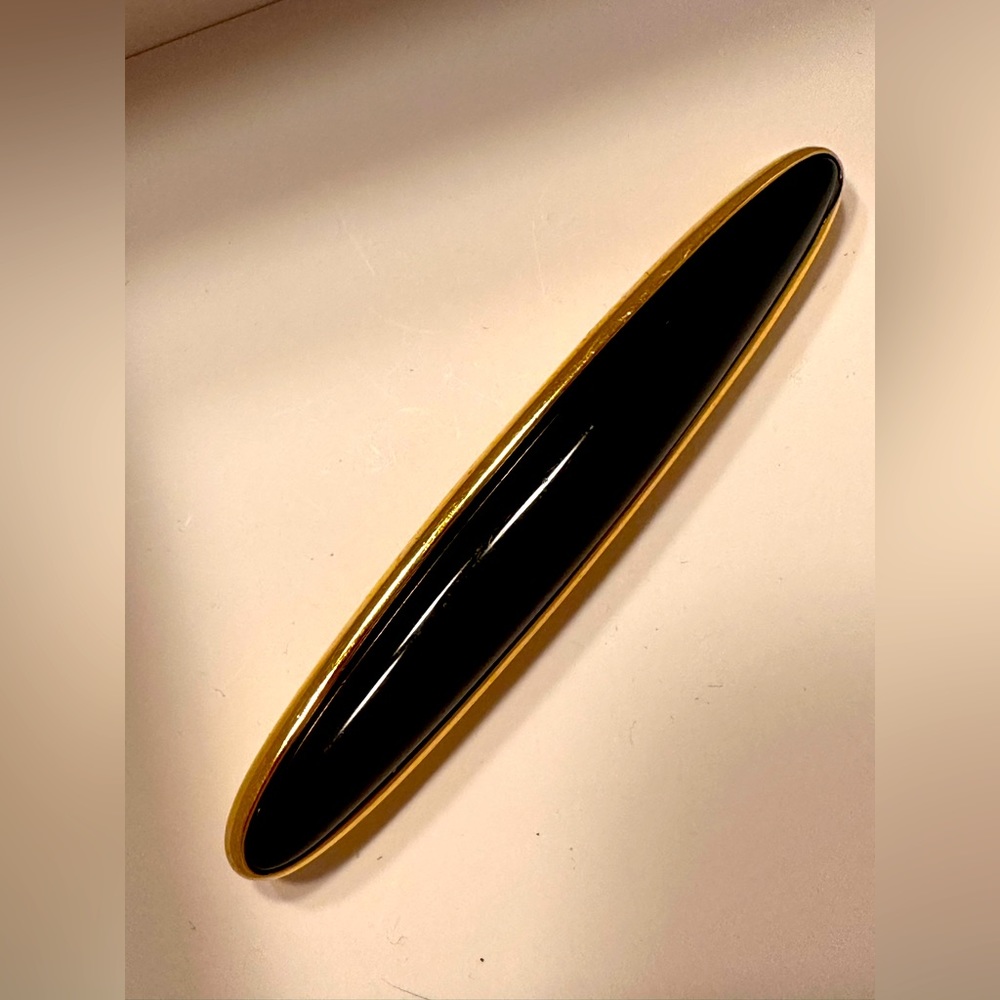 Vintage Monet, faux Onyx, and gold tone roach